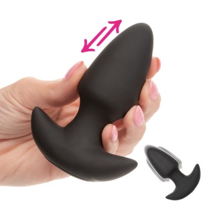 Plug anal vibrant avec action de poussée Rock Bottom tenu à la main